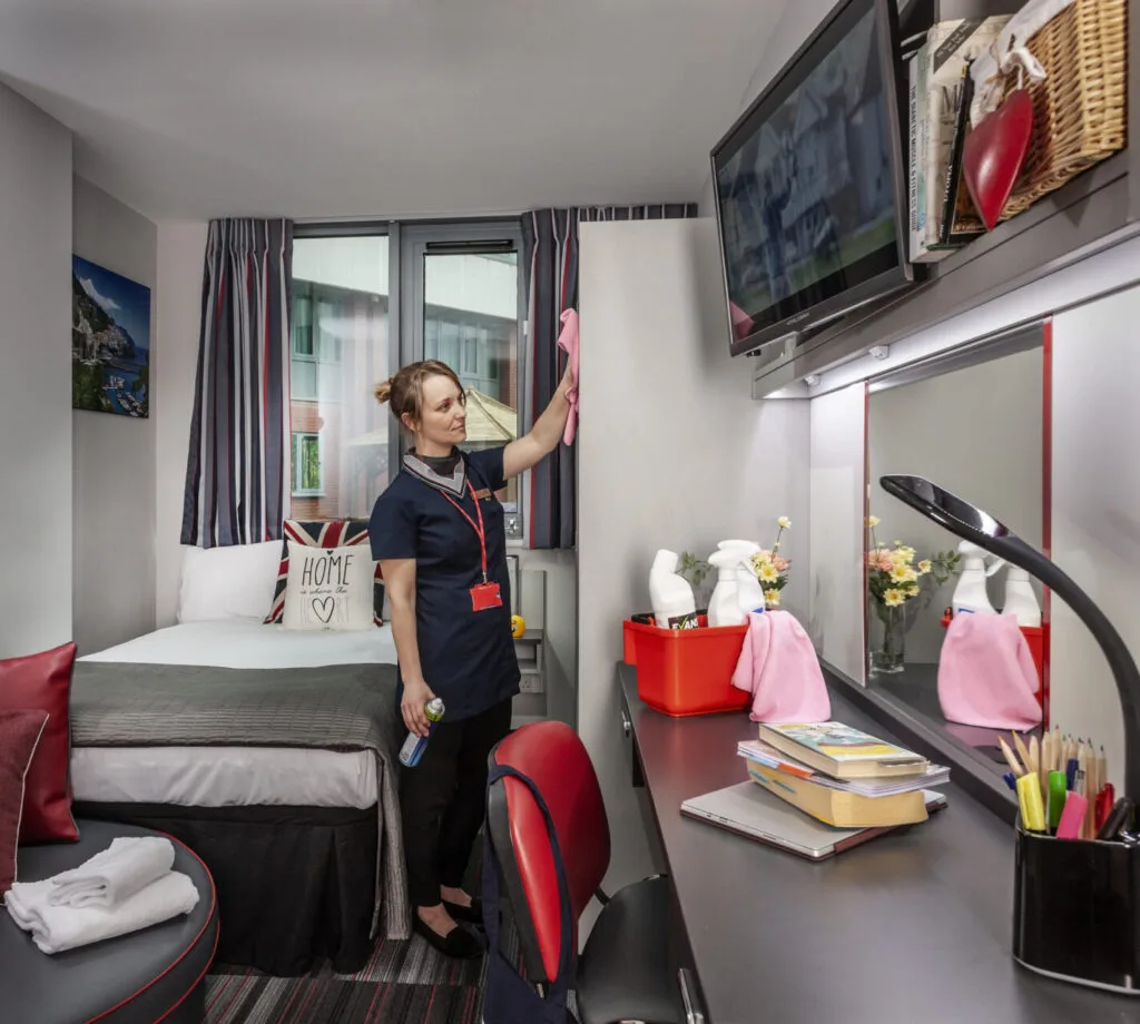 Study Inn housekeeping service team member cleaning one of the students rooms