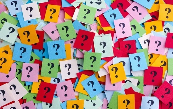 Lost of question marks on colourful pieces of paper.