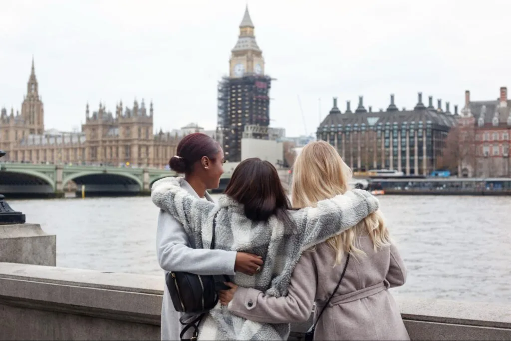 3 female students over looking the river