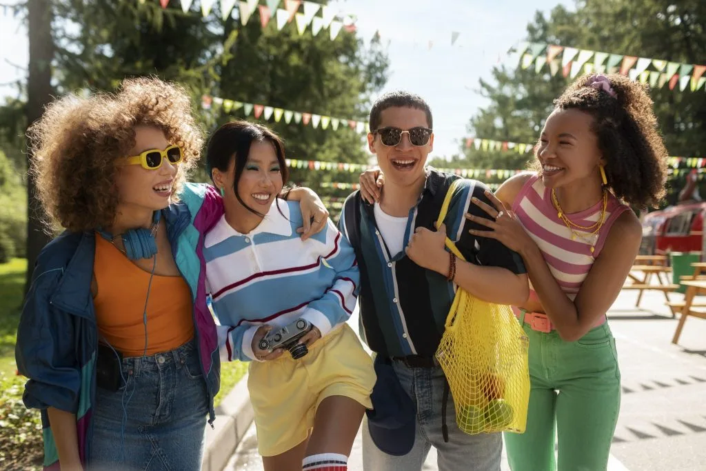 Group of students bonding outdoors at a vibrant social event near Student accommodation in Bristol.