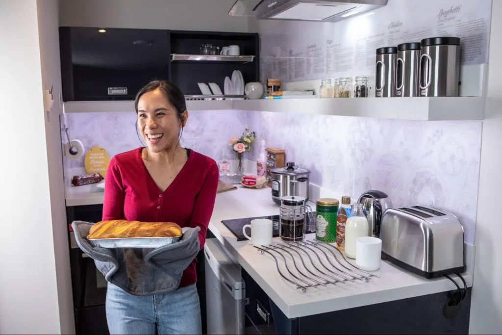 Resident baking in a modern kitchen at Student Accommodation in Leicester at Study Inn