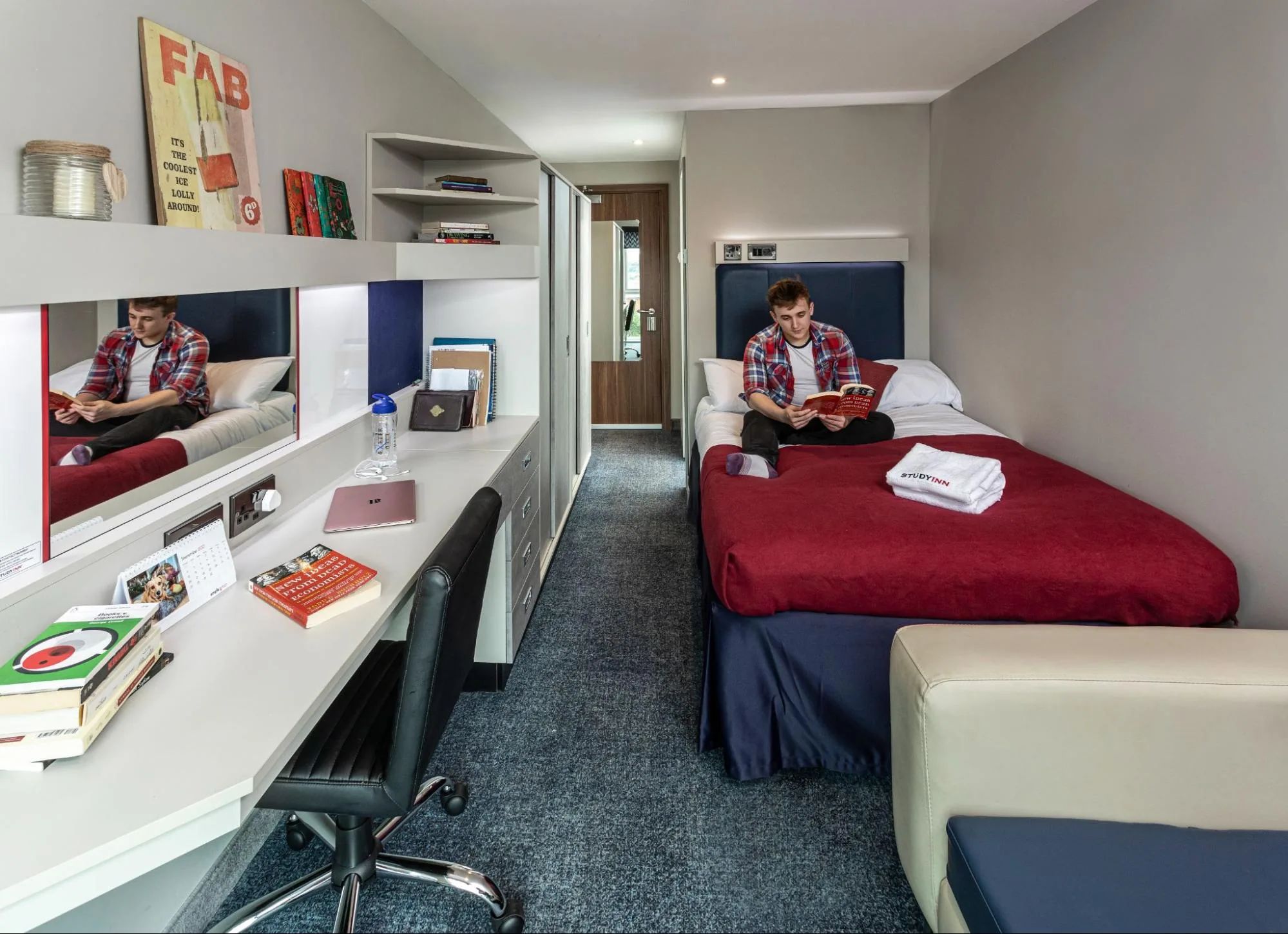 student reading a book at the Study Inn accommodation in Exeter.