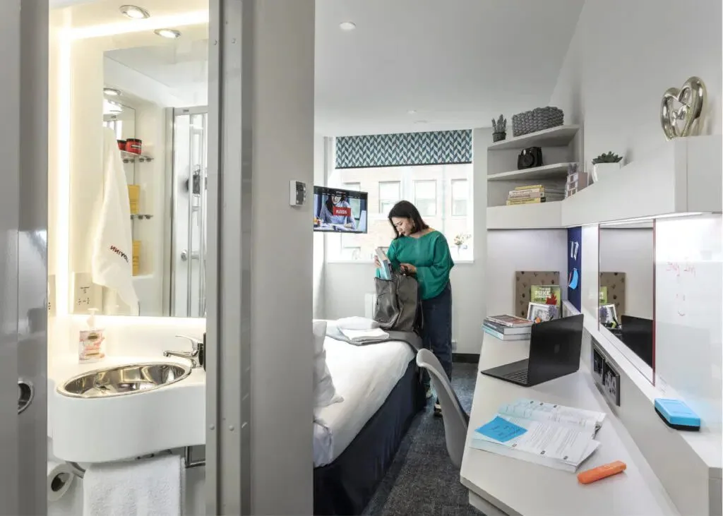 Modern ensuite bedroom at Study Inn student accommodation in Leeds with a study desk and a private bathroom.