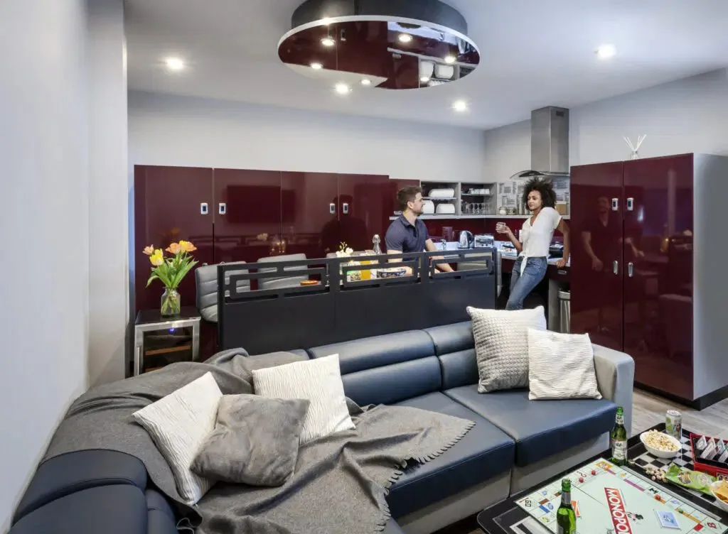 Students socialising in a modern shared kitchen and lounge at Study Inn student accommodation in Loughborough.