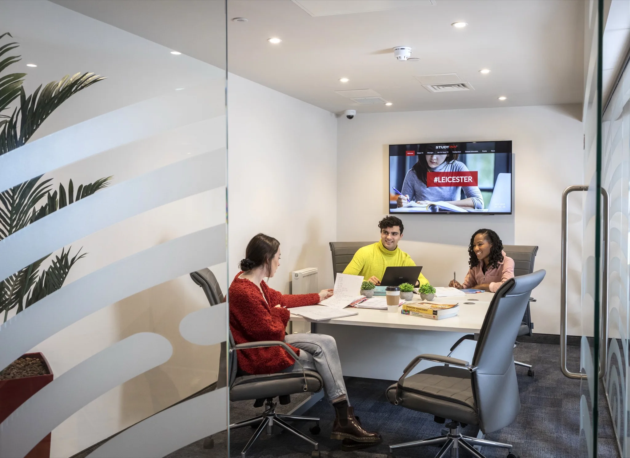 Students working together in a group study room at Study Inn Reynard House, Leicester