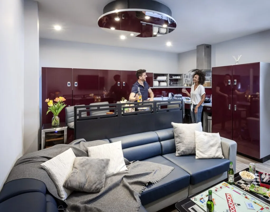 Open-plan lounge and kitchen in a Study Inn Lemyngton Street apartment, Loughborough