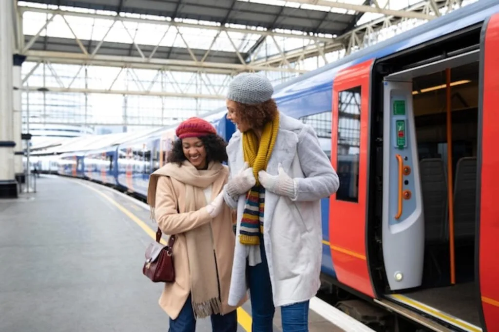 Students boarding a train at a railway station platform