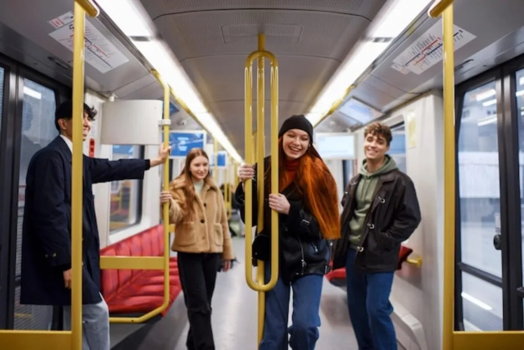 Students travelling on a tram in Birmingham