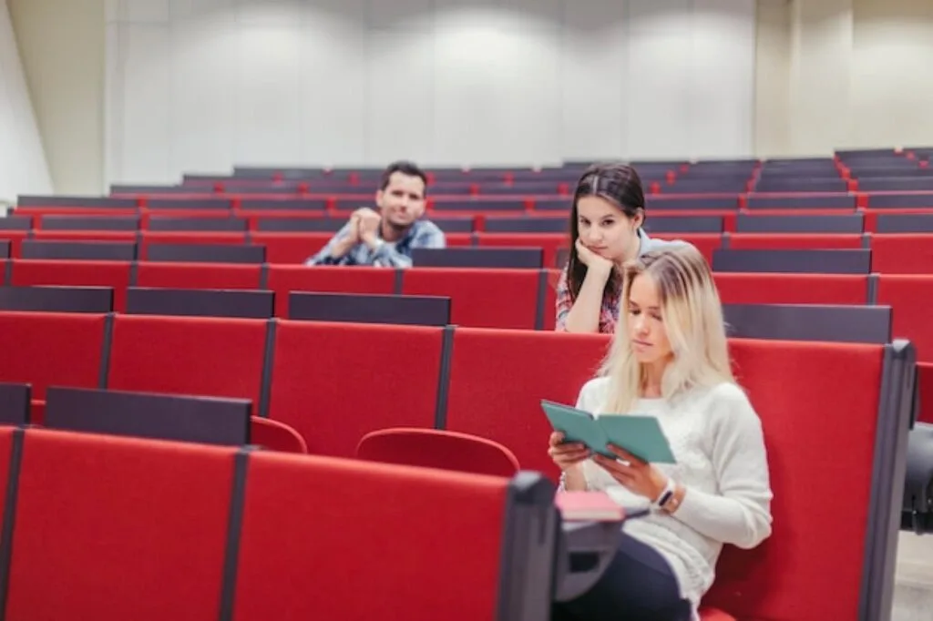 Students sitting in a university lecture theatre