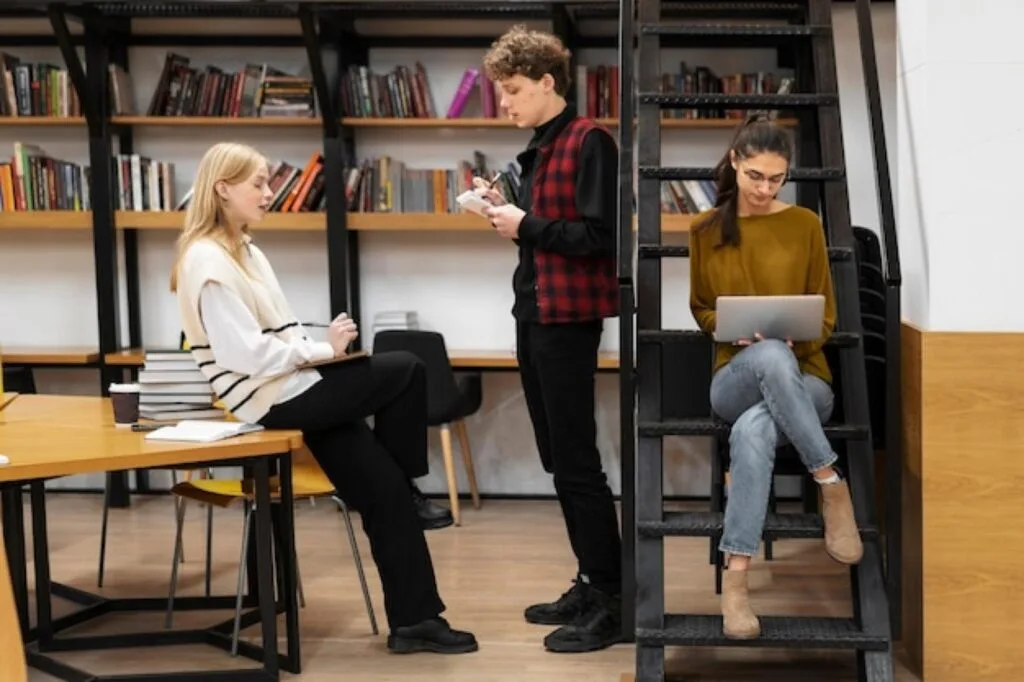 Students working in a modern university library