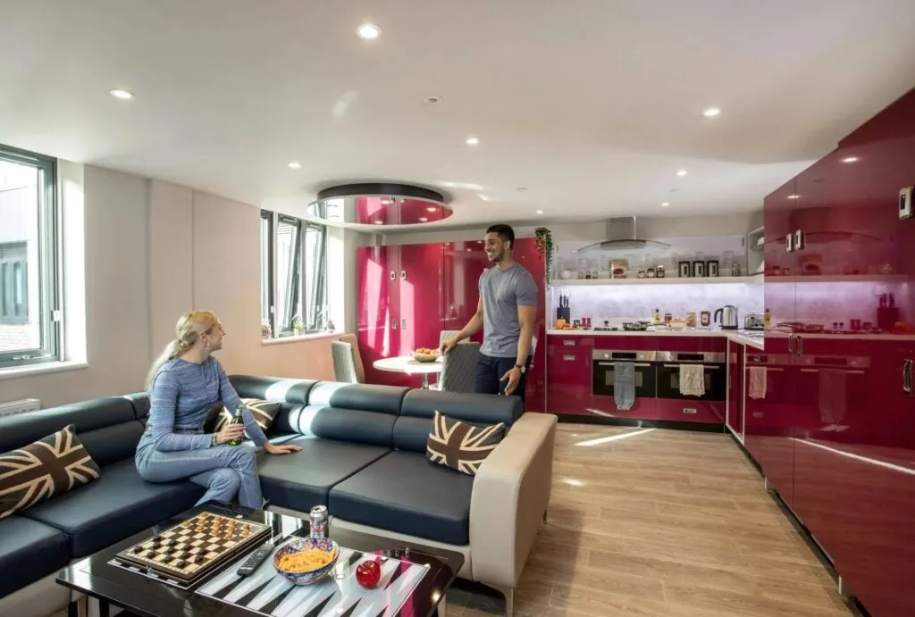 The Luxe Lounge at Study Inn, with a shared kitchen, sofas and a dining area