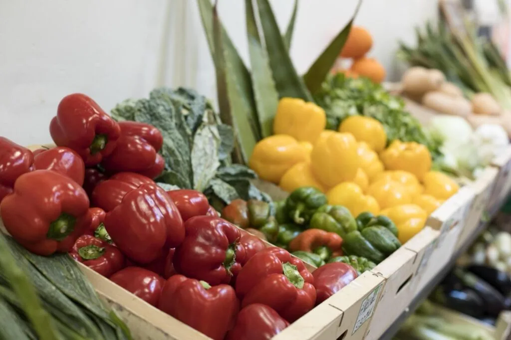 Fresh produce on display at a city market stall